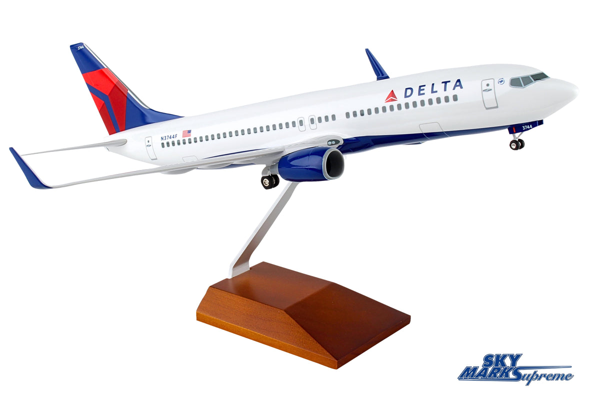 SKYMARKS DELTA 737-800 1/100 W/GEAR & WOOD STAND The Airplane Shop.