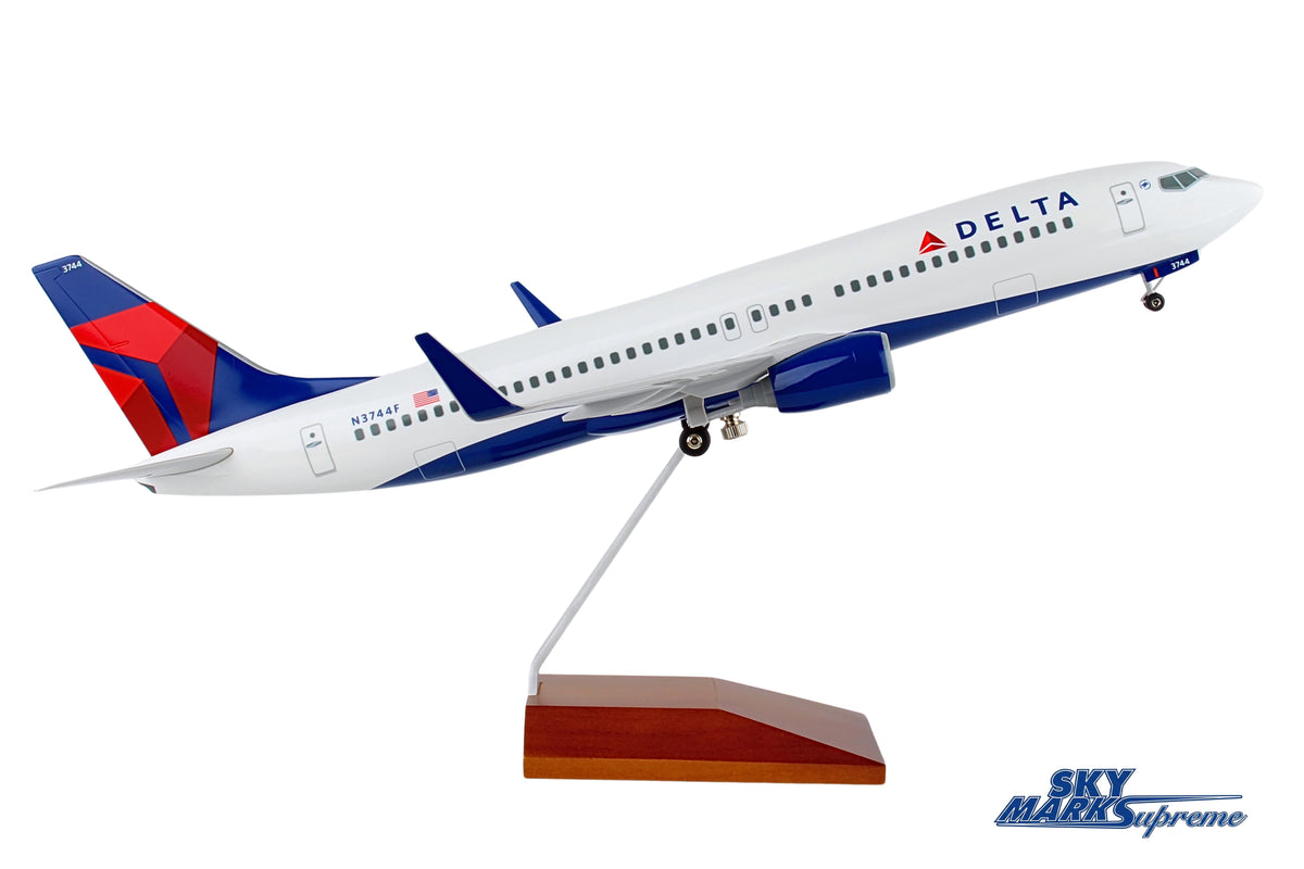 SKYMARKS DELTA 737-800 1/100 W/GEAR & WOOD STAND The Airplane Shop.