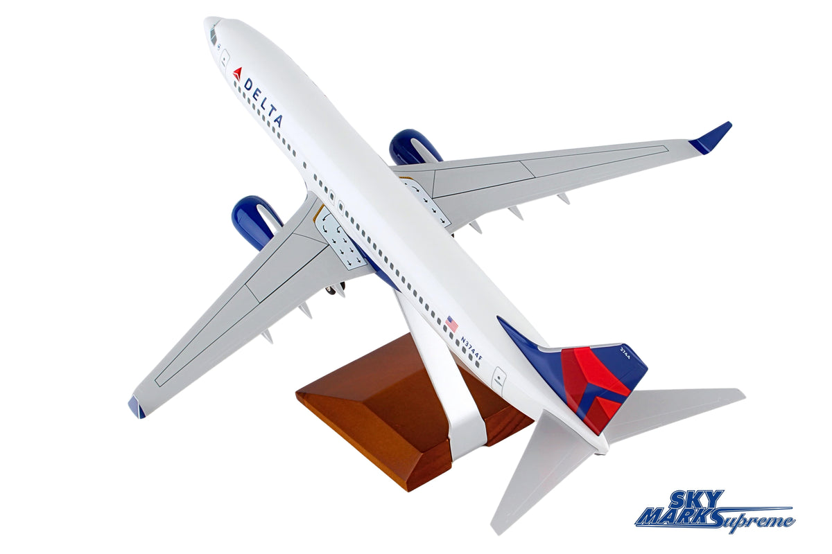 SKYMARKS DELTA 737-800 1/100 W/GEAR & WOOD STAND The Airplane Shop.